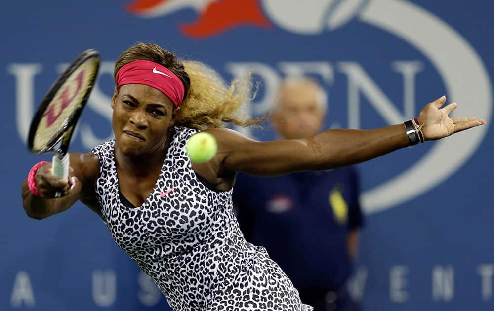 Serena Williams, of the United States, returns a shot to Flavia Pennetta, of Italy, during the quarterfinals of the US Open tennis tournament.