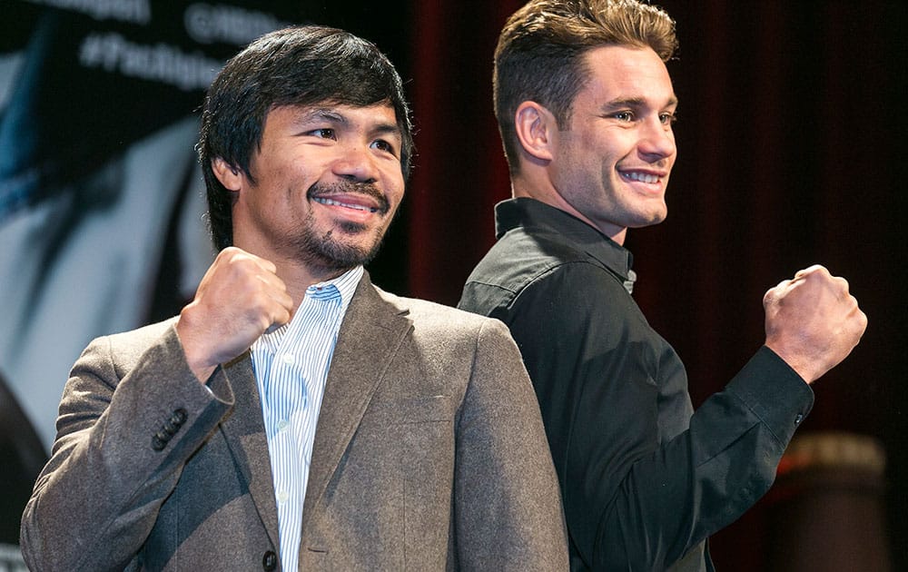 Boxers Manny Pacquiao, left, and Chris Algieri pose for a photo in Los Angeles.