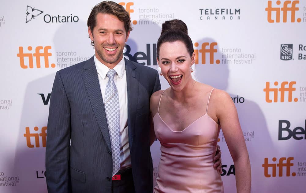 Tessa Virtue, right, and Ryan Semple arrive on the red carpet at the 3rd Annual Charity Gala during the 2014 Toronto International Film Festival.