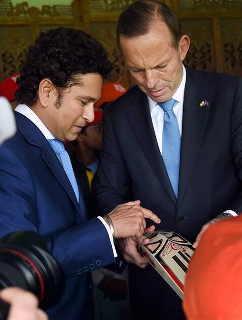 Legendary cricketer Sachin Tendulkar and Australian Prime Minister Tony Abbott during an interactive session with children at Cricket Club of India (CCI) in Mumbai.