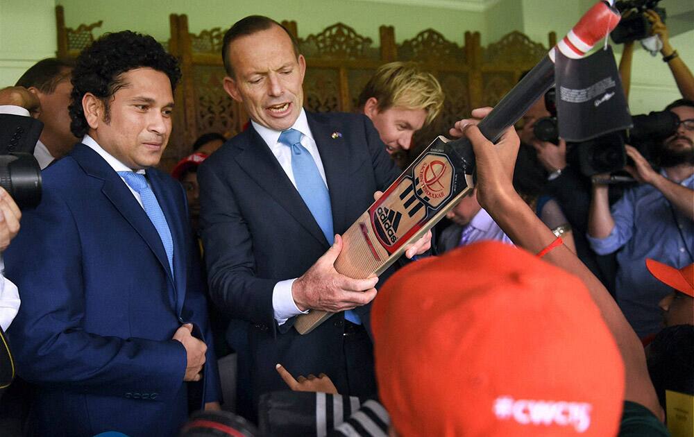 Legendary cricketer Sachin Tendulkar and Australian Prime Minister Tony Abbott during an interactive session with children at Cricket Club of India (CCI) in Mumbai.