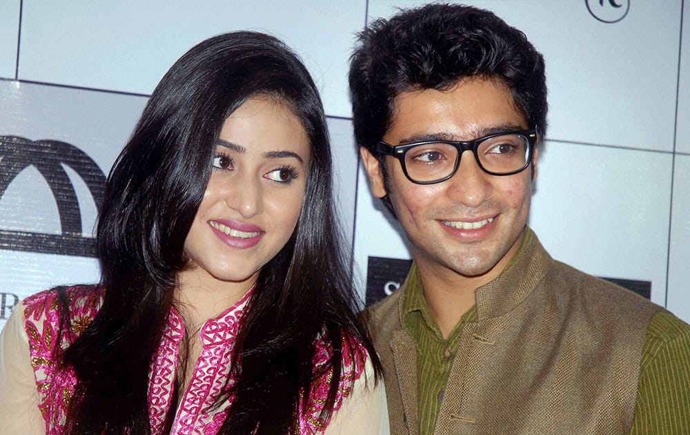 Tollywood actors Riddhima Ghosh and Gaurav Chakraborty (R) during a promotional event for the upcoming Durga Puja festival,in Kolkata.