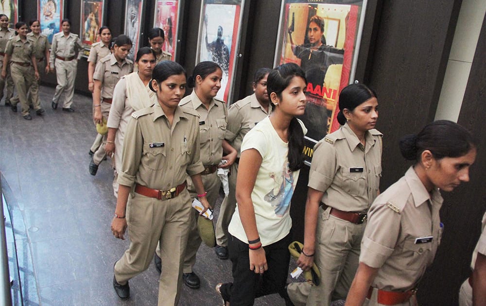 Police women arrive to watch 'Mardani'.