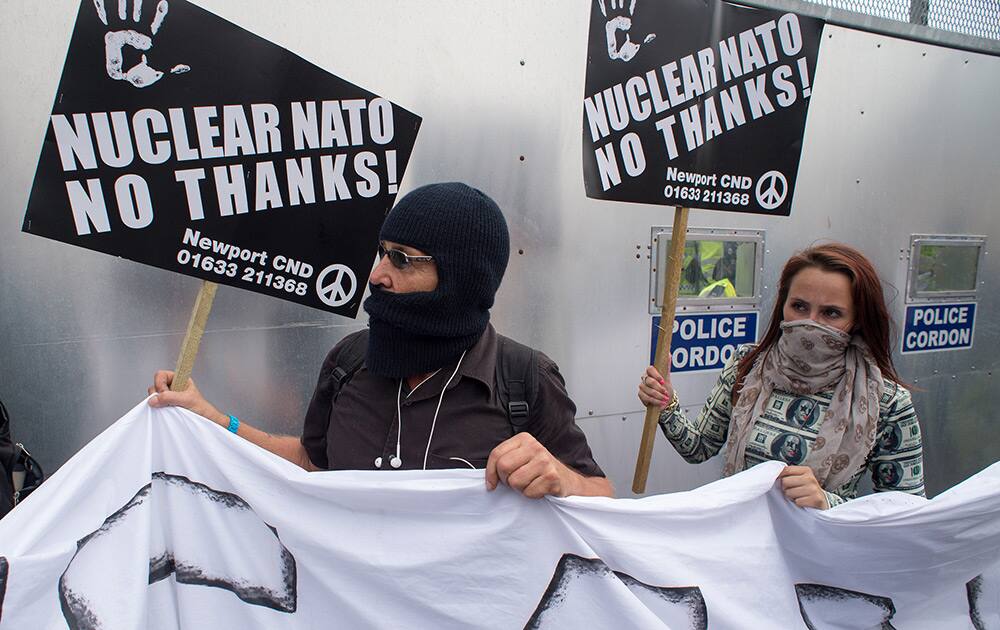 Protesters march towards Celtic Manor in Newport, Wales. Demonstrators gathered in the centre of Newport to hold a march at the start of a two-day NATO summit at Celtic Manor Resort in Newport.