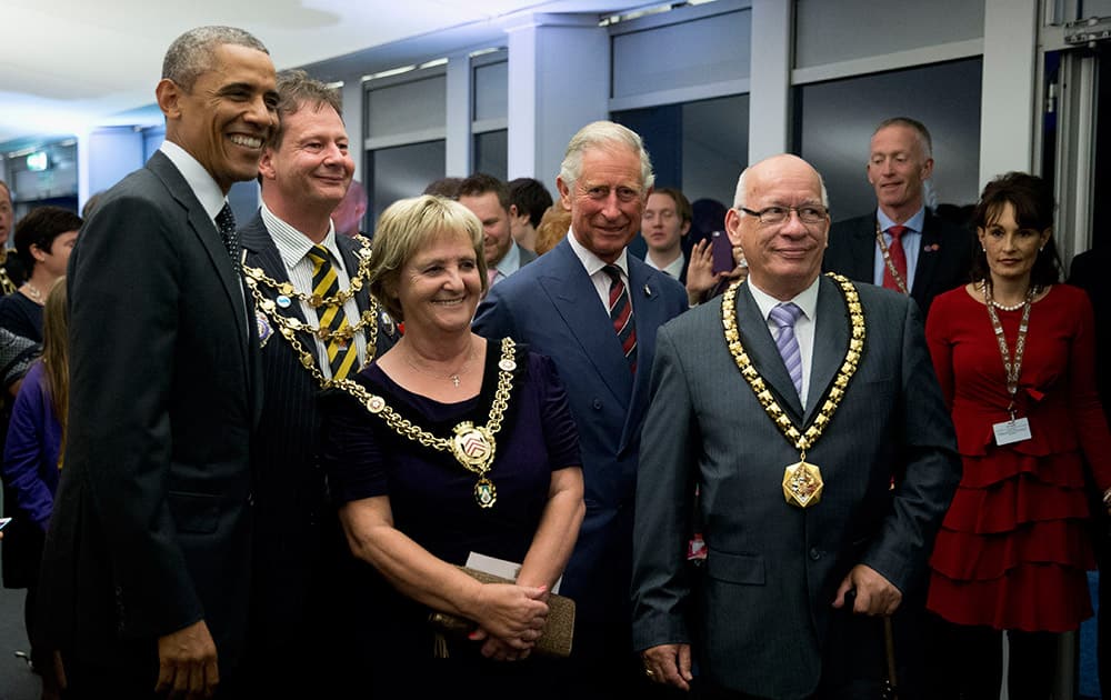 US President Barack Obama poses for photographs with local dignitaries and Britain's Prince Charles, fourth left, whilst attending a 'Welcome the World to Wales' reception hosted by the Prince as part of a NATO summit at the Celtic Manor Resort in Newport, Wales.
