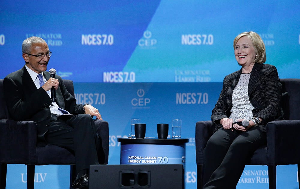 Former Secretary of State Hillary Rodham Clinton, right, takes questions from John Podesta, counselor to President Barack Obama, at the National Clean Energy Summit.