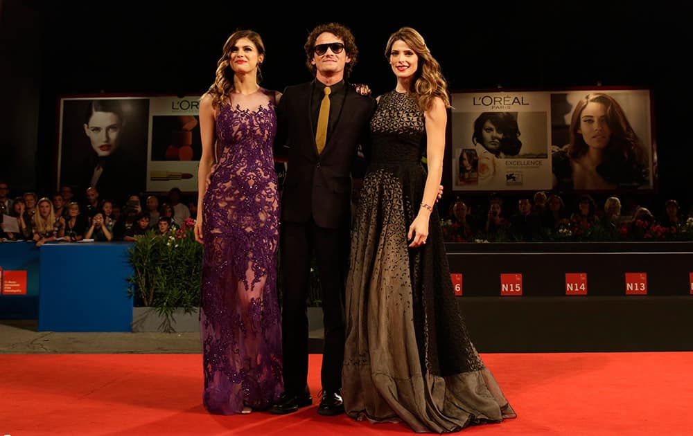 Actors Alexandra Daddario, Antoin Yelchin, and Ashley Greene pose for photographers as they arrive for the screening of Burying the Ex at the 71st edition of the Venice Film Festival in Venice, Italy.