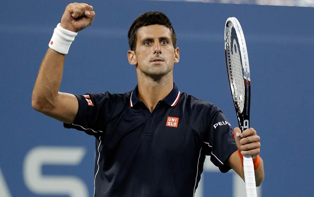 Novak Djokovic, of Serbia, reacts after winning a game against Andy Murray, of Britain, during the quarterfinals of the US Open tennis tournament.