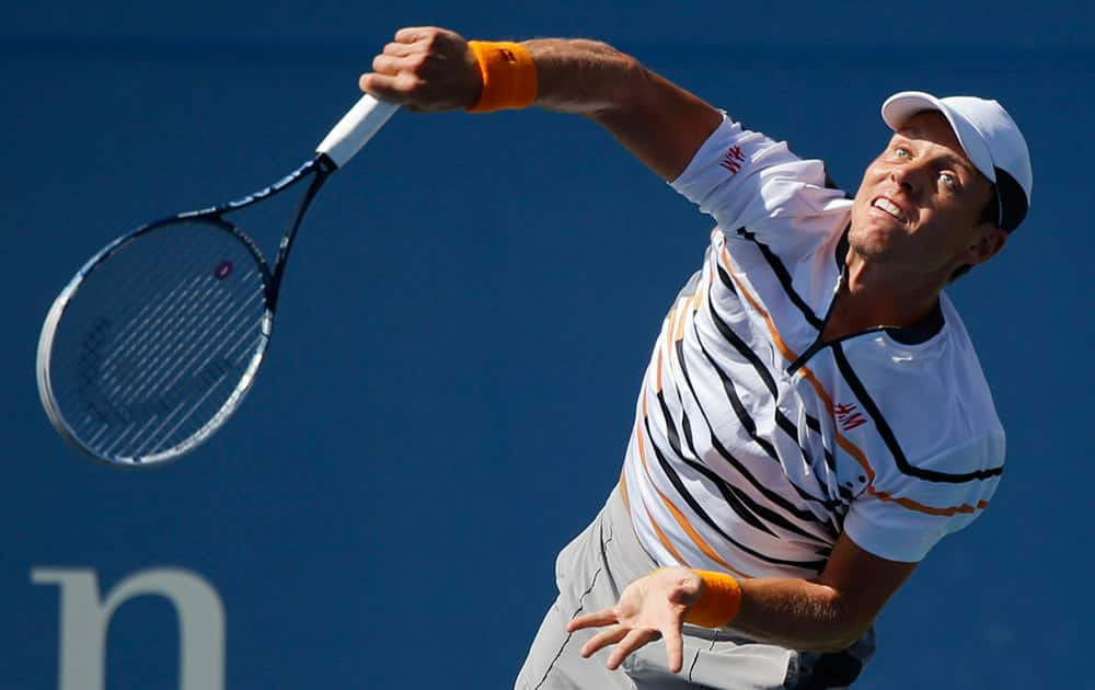 Tomas Berdych, of the Czech Republic, serves against Marin Cilic, of Croatia, during the quarterfinals of the 2014 US Open tennis tournament.