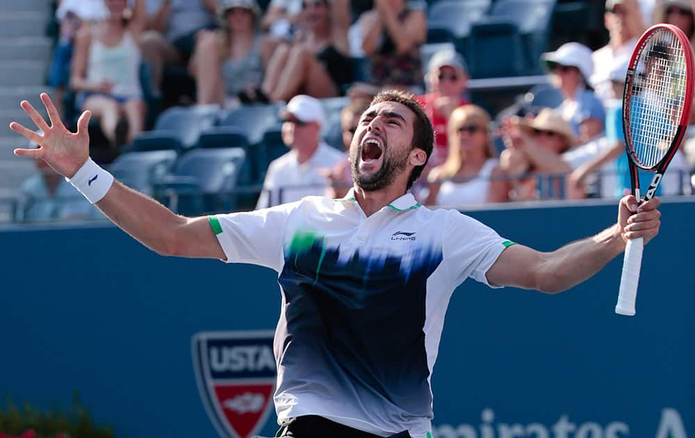 Marin Cilic, of Croatia, reacts after defeating Tomas Berdych, of the Czech Republic, during the quarterfinals of the 2014 U.S. Open tennis tournament.