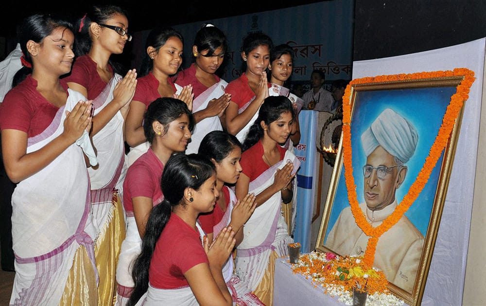 Students pay tributes to a portrait of former President Dr Sarvepalli Radhakrishnan on the latter's birth anniversary at a school in Guwahati.