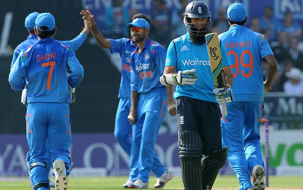 Moeen Ali walks back to the pavilion after being bowled by India's Bhuvneshwar Kumar caught Umesh Yadav for 9 runs during the fifth One Day International match between England and India at Headingley cricket ground, Leeds, England.