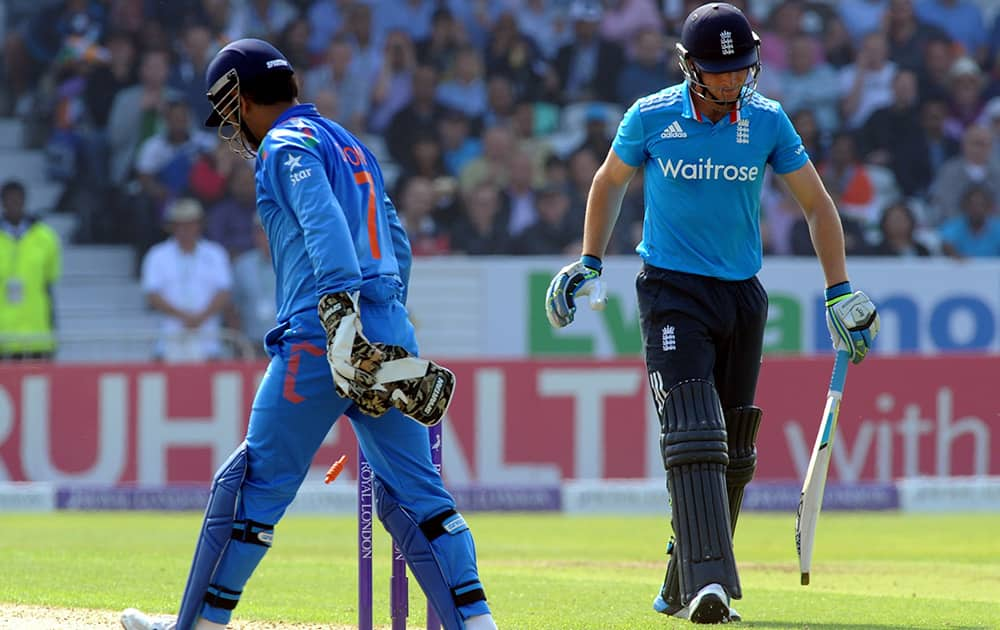 England's Jos Buttler is run out by India's M S Dhoni during the fifth One Day International match between England and India at Headingley cricket ground, Leeds, England.