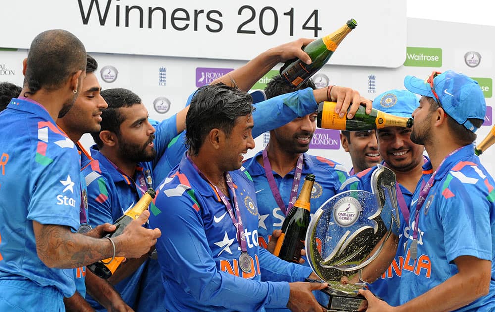 India players celebrate defeating England 3-1 to win the series after their fifth One Day International match at Headingley cricket ground, Leeds.