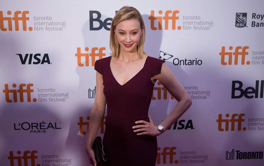 Sarah Gadon arrives on the red carpet at the 3rd Annual Charity Gala during the 2014 Toronto International Film Festival in Toronto.