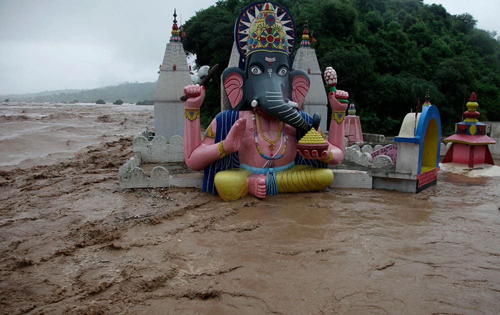 Floodwaters engulf temples in Jammu.