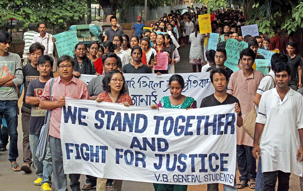 Students of Visva Bharati University walk in a silent rally asking for justice in a recent case of sexual molestation of a student of the university, in Santiniketan.