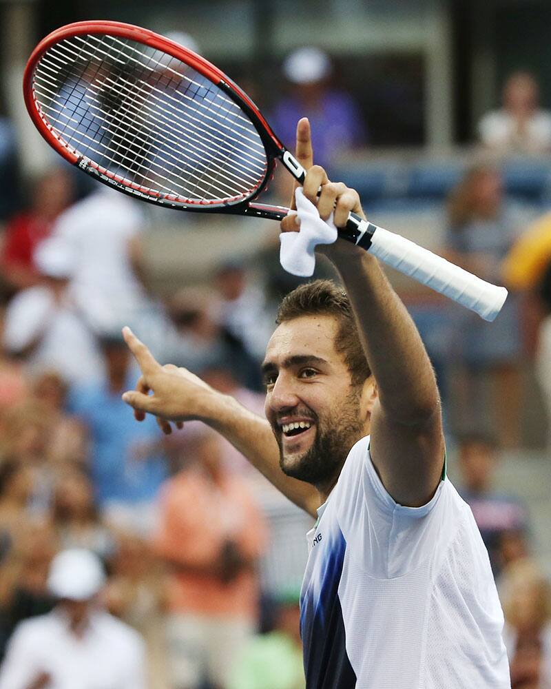 Marin Cilic, of Croatia, reacts defeating Roger Federer, of Switzerland, during the semifinals of the 2014 US Open tennis tournament.