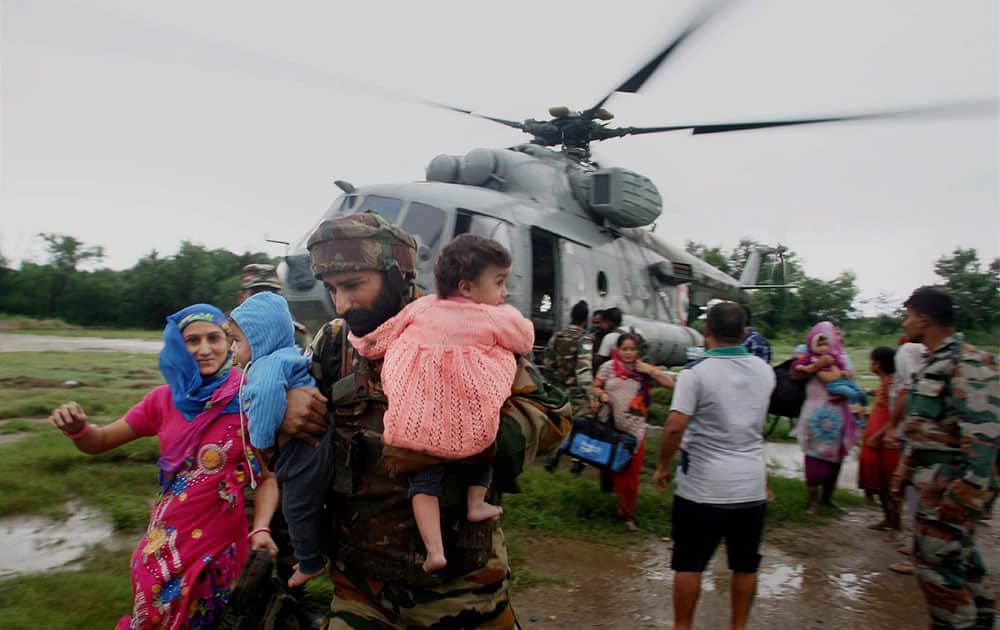 THE INDIAN AIR FORCE HELICOPTERS CARRYING OUT RESCUE, RELIEF AND EVACUATION OF PEOPLE MAROONED DURING THE FLOOD FURY, IN JAMMU AND KASHMIR.