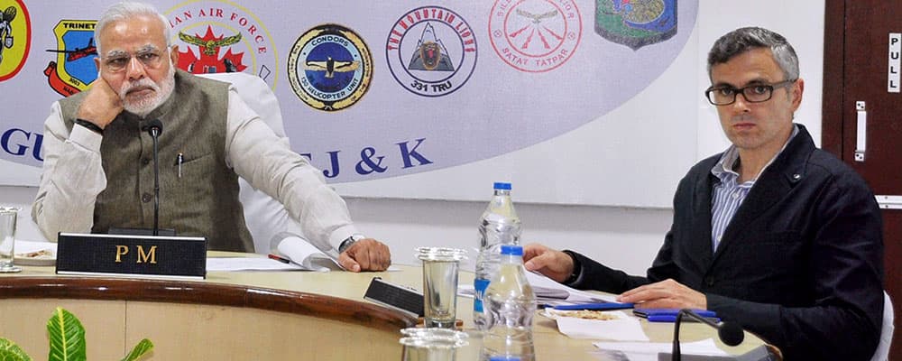 Prime Minister Narendra Modi holds a review meet with J&K Chief Minister Omar Abdullah and other administration officials at Technical Airport in Jammu.