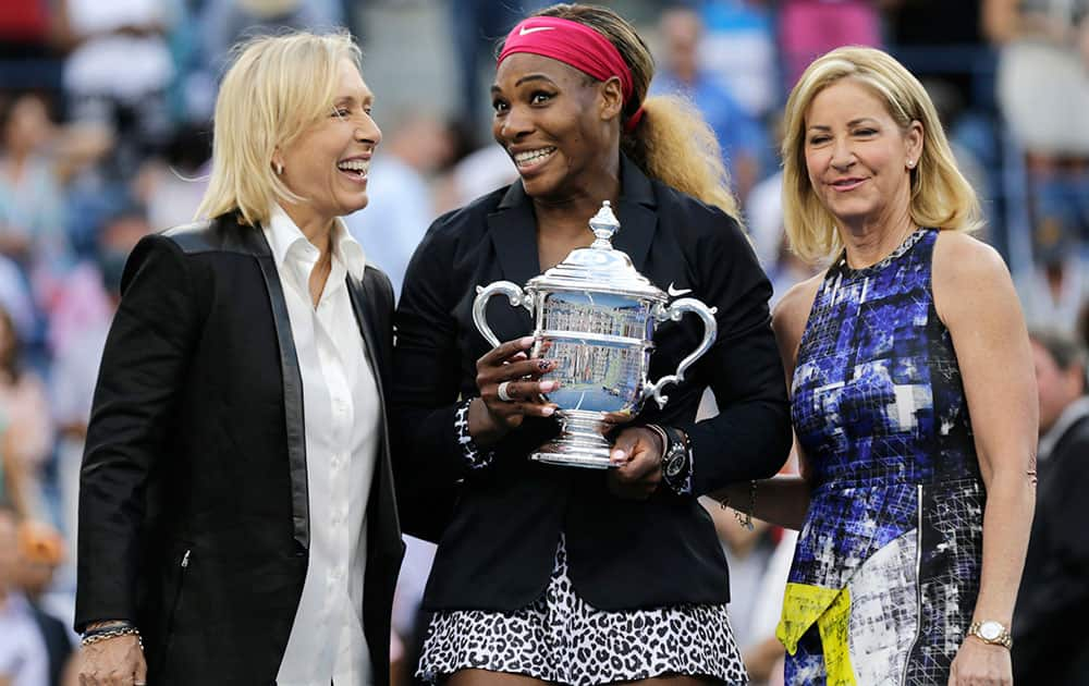 Martina Navratilova, left, and Chris Evert, right, pose for a photo with Serena Williams after Williams defeated Caroline Wozniacki, of Denmark, in the championship match of the 2014 US Open tennis tournament.