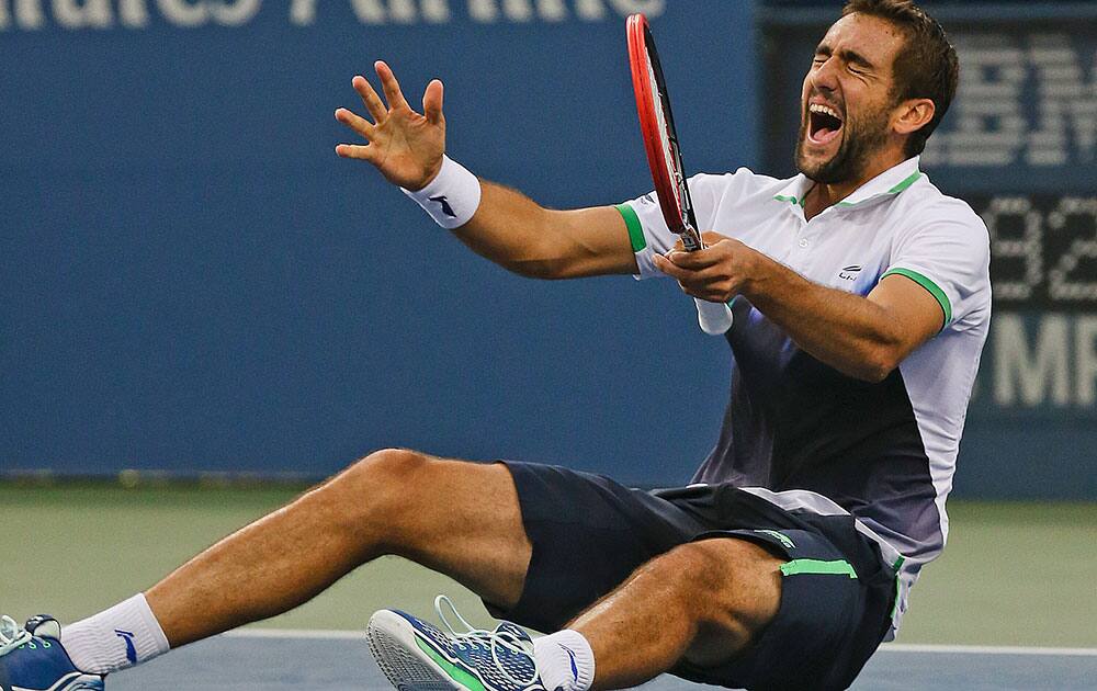 Marin Cilic, of Croatia, reacts after defeating Kei Nishikori, of Japan, during the championship match of the 2014 US Open tennis tournament.