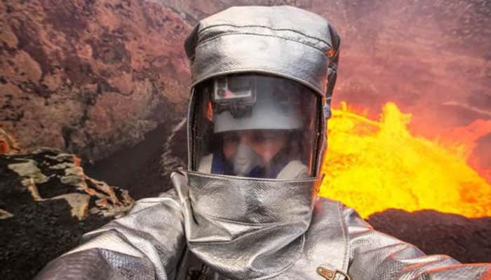 Watch: Man jumps inside an active erupting volcano, takes incredible selfie