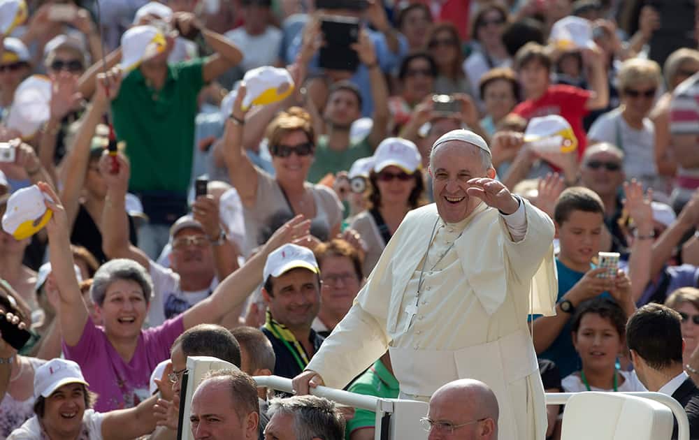 Pope Francis arrives in his popemobile to hold his weekly general audience in St.Peter's Square, at the Vatican.