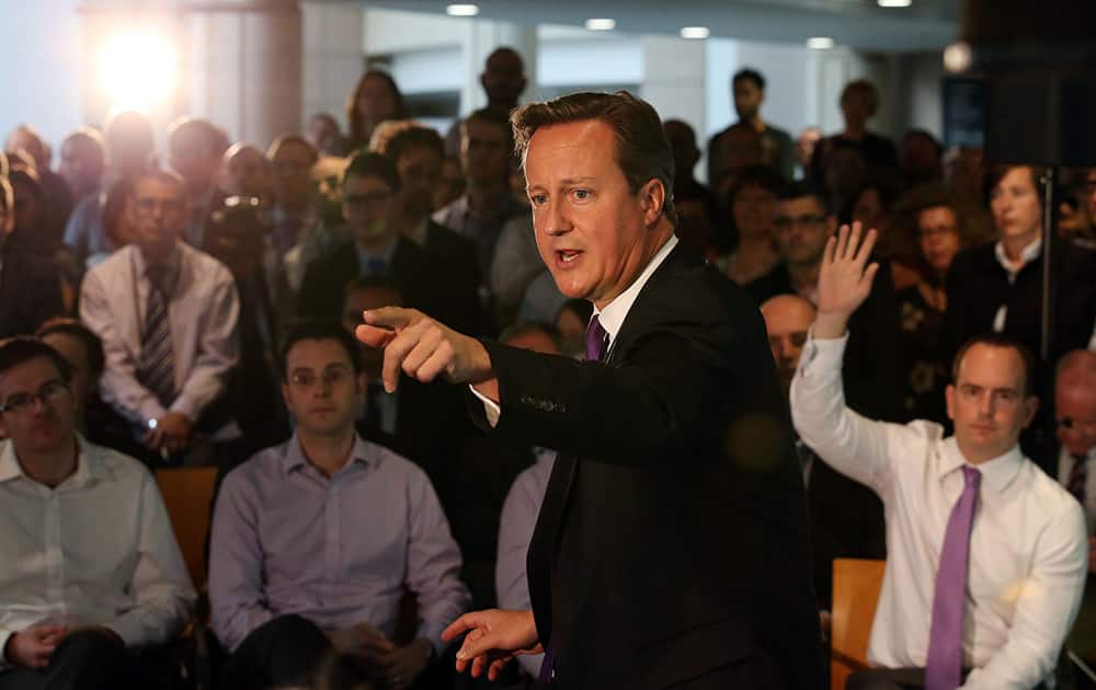 Britain's Prime Minister, David Cameron, speaks during a visit to a financial office in Edinburgh