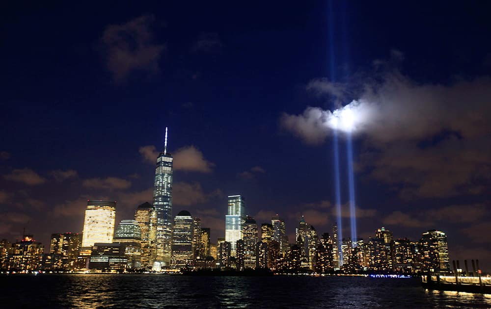 The Tribute in Lights is seen from Jersey City, N.J., as it rises above the New York City Skyline, the eve of the 13th anniversary of the 9/11 terrorist attacks.