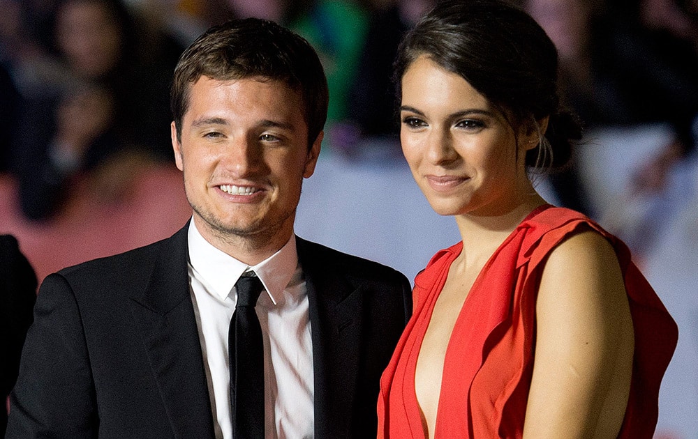 Actors Josh Hutcherson, left, and Claudia Traisac, pose for photographs on the red carpet for the new movie 'Escobar: Paradise Lost' during the 2014 Toronto International Film Festival in Toronto.