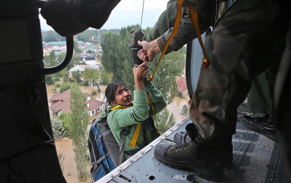 A tourist cries as she is airlifted by a chopper in Srinagar.