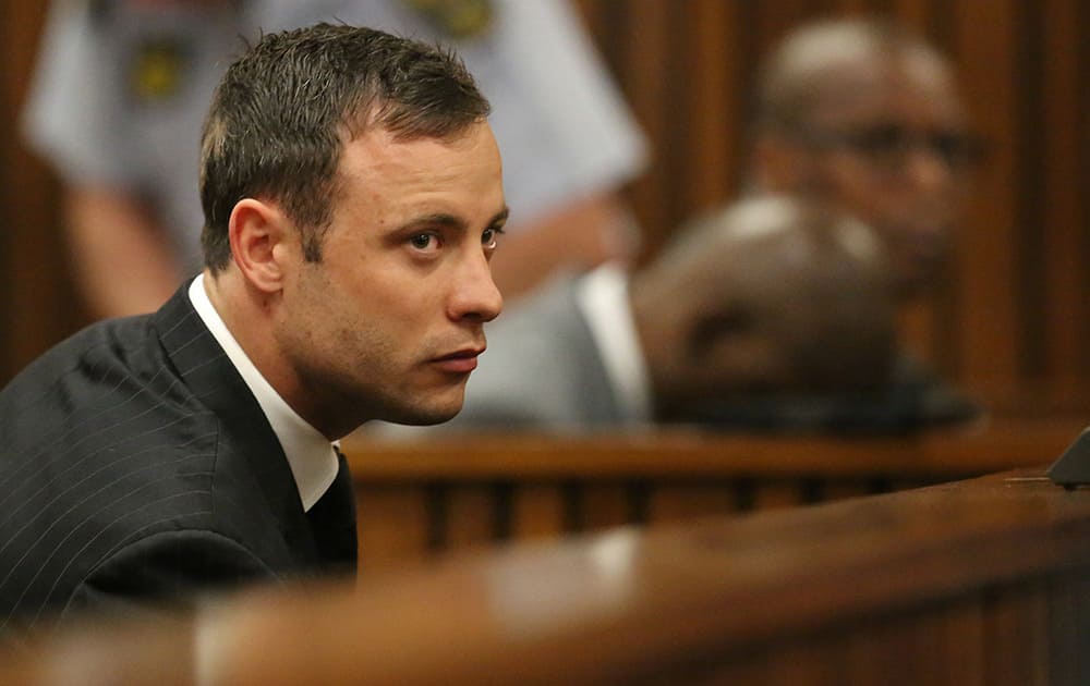 Oscar Pistorius sits in the dock looking in court in Pretoria, South Africa. Judge Thokozile Masipa found Pistorius guilty of culpable homicide for the shooting death of his girlfriend Reeva Steenkamp. Sentencing procedures will start Oct. 13.