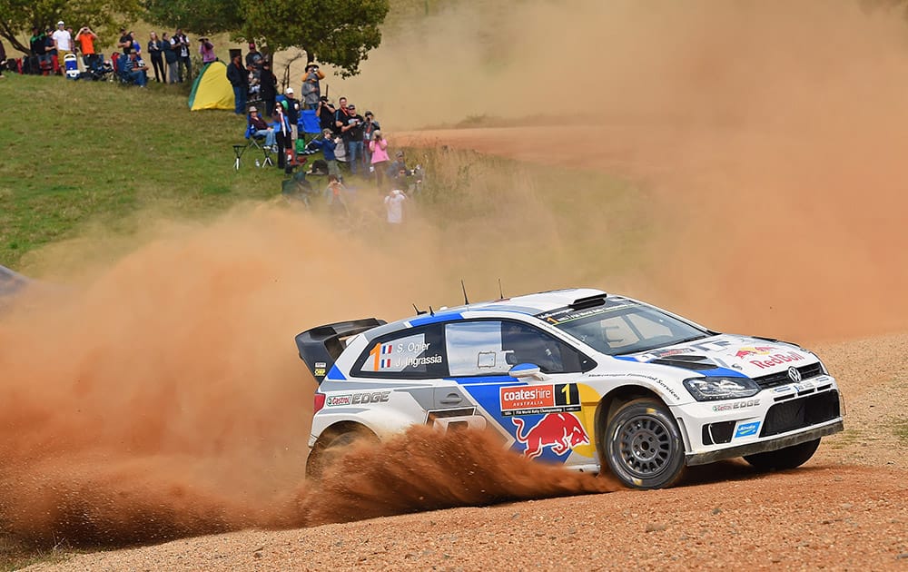 In this photo provided by Rally Australia, Sebastien Ogier and co-driver Julien Ingrassia, both from France, race their car during the Australian leg of the World Rally Championship new Coffs Harbour.