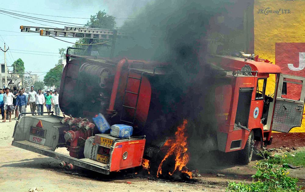 Angry mob burnt a fire brigade vehicle after the death of a school boy in Ballabgarh, Faridabad.