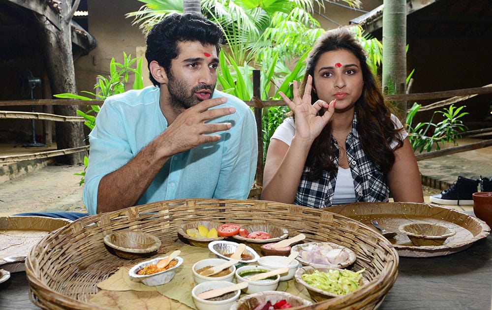 Bollywood actors Aditya Roy Kapoor and Pareeniti Chopra taking Gujarati lunch during a promotional event of their up coming movie Daawat-e-Ishq.