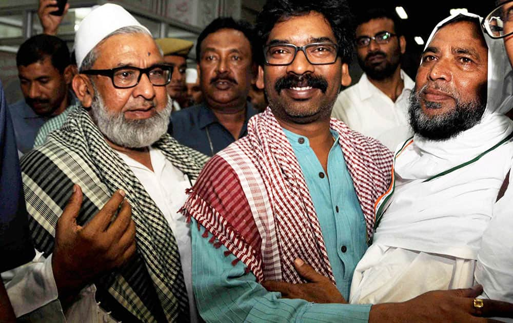 Jharkhand Chief Minister Hemant Soren greets a haj pilgrim while seeing off the first batch of 240 Haj pilgrims from Birsa Munda International airport in Ranchi.