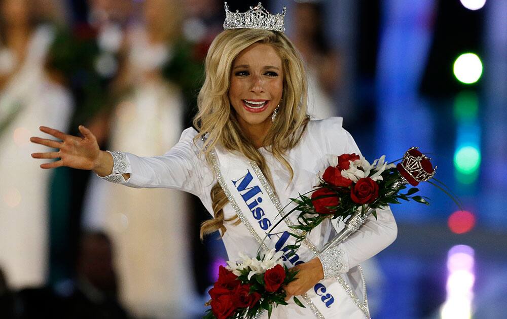 Miss New York Kira Kazantsev, right, walks the runway after she was named Miss America 2015 during the Miss America 2015 pageant, in Atlantic City, N.J.