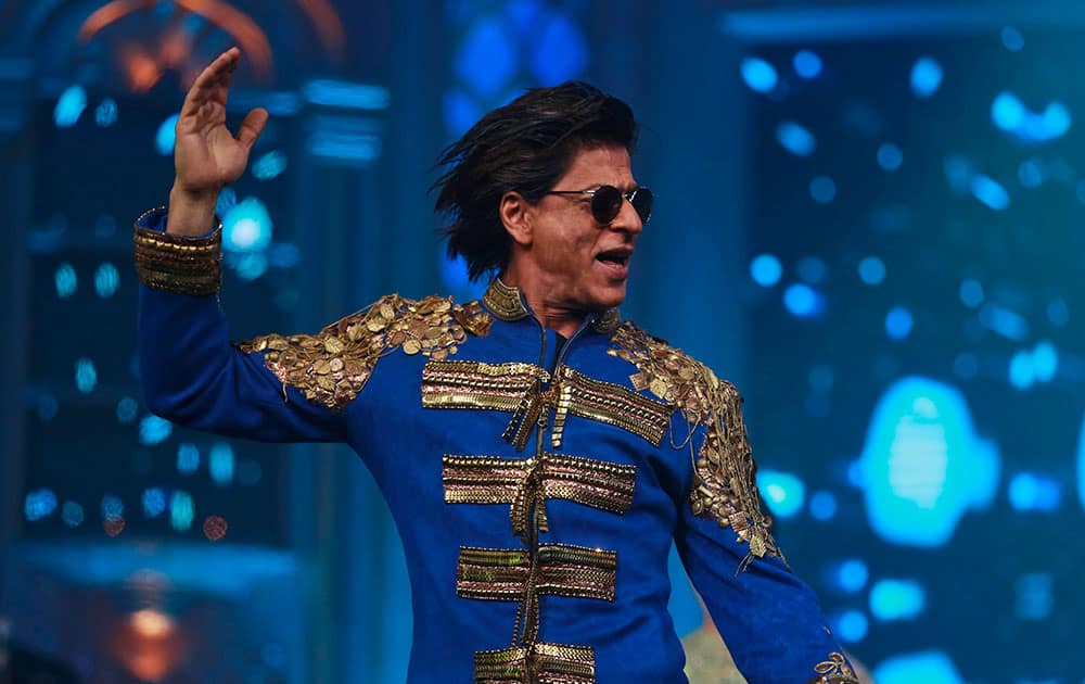 Bollywood actor Shah Rukh Khan performs during a music launch of his upcoming film `Happy New Year` in Mumbai.