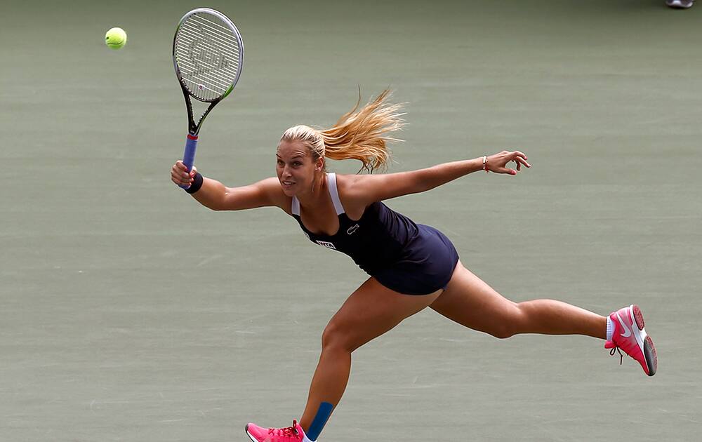 Dominika Cibulkova of Slovakia returns a shot to Coco Vandeweghe of the United States during their second round match of the Japan Pan Pacific Open tennis tournament in Tokyo.