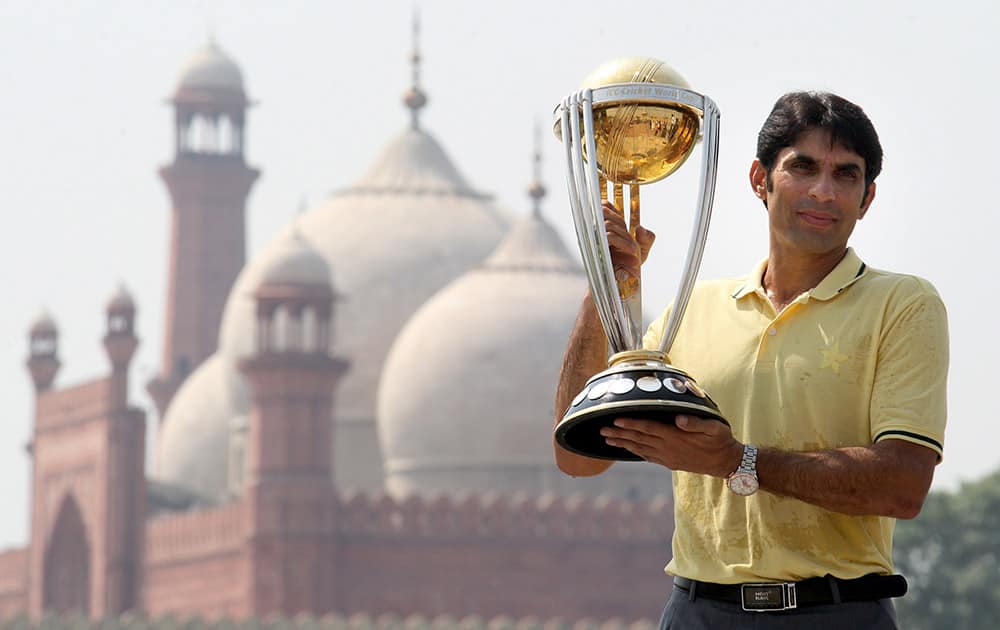 Pakistan captain Misbah-ul-Haq holds the cricket World Cup 2015 trophy in front of the historical Badshahi Mosque in Lahore, Pakistan.