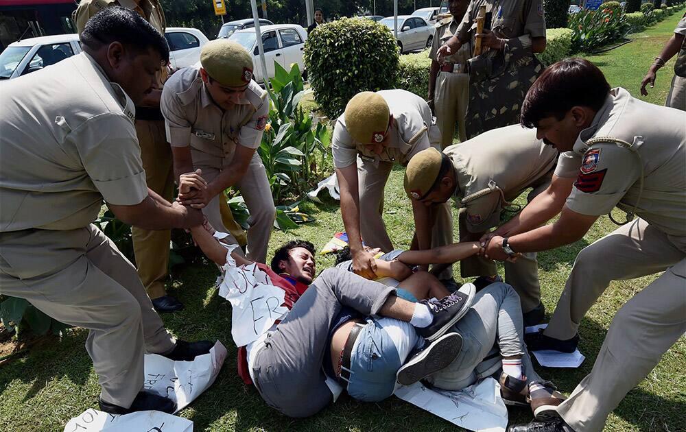 Police detain Tibetan activists who were holding a protest against China’s President Xi Jinpings visit to India, outside the Chinese embassy in New Delhi.