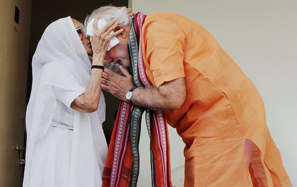 Prime Minister Narendra Modi takes his mother, Hirabais blessing on the occasion of his 64th birthday.