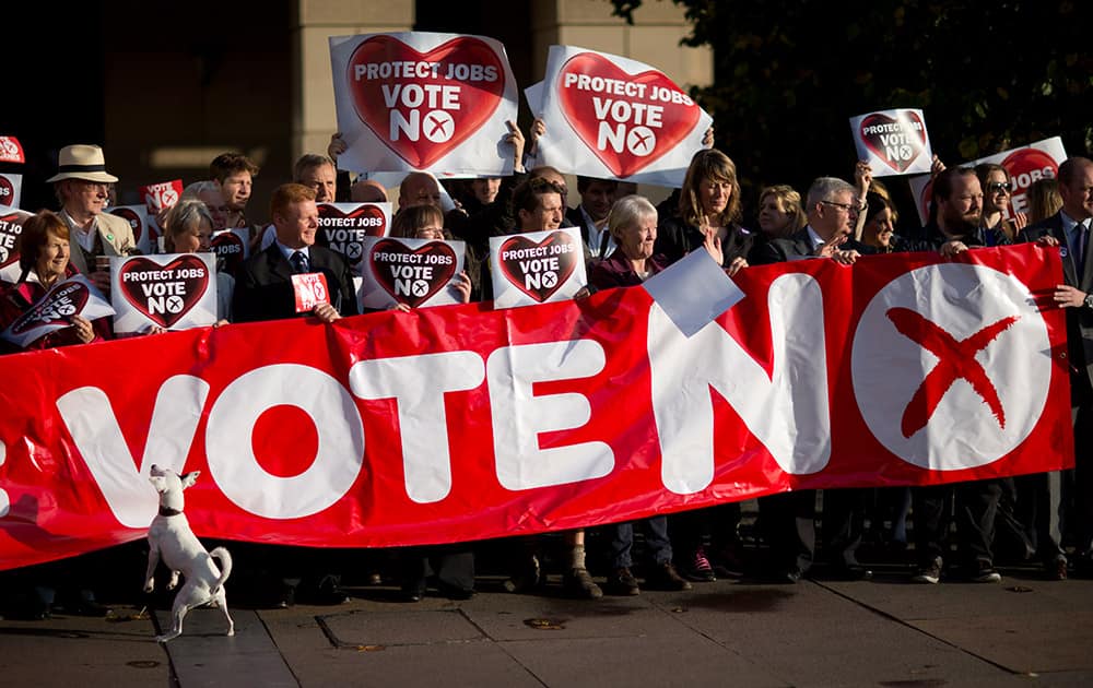 Supporters for the No campaign for the Scottish Independence Referendum hold up a banner for the media in Edinburgh, Scotland.