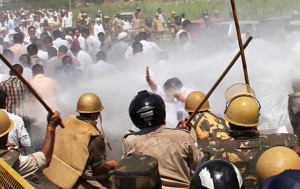 Police lathicharge RLD supporters who were holding a protest against the Union government over the cut-off of electricity from party leader Ajit Singhs official bungalow following repeated eviction notices, at Muradnagar in Ghaziabad.