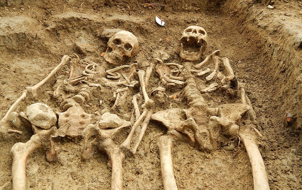 This photo released by the University of Leicester, two skeletons are uncovered by archeologists at Chapel of St Morrell in Leicestershire.