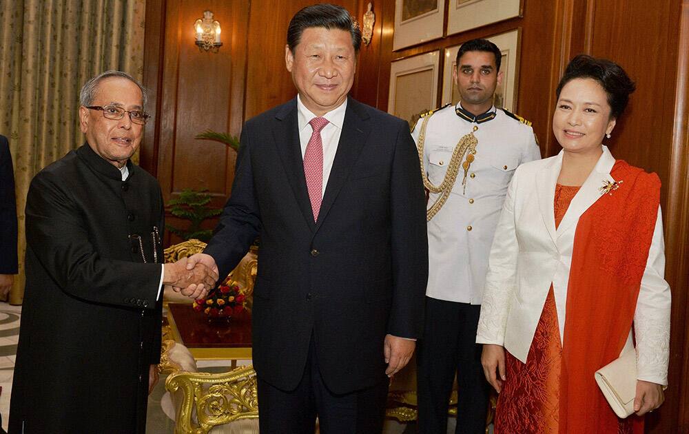 President Pranab Mukherjee with Chinese President Xi Jinping and his wife Peng Liyuan during a meeting in New Delhi.