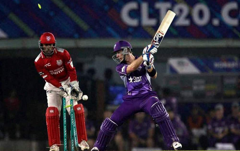 Hobart Hurricanes captain Tim Paine being bowled by Akshar Patel of Kings XI Punjab during their Champions League Twenty20 match at Mohali