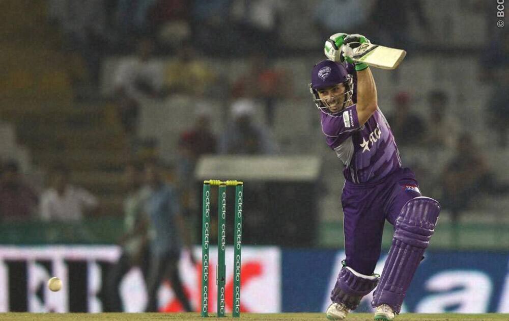 Hobart Hurricanes batsman Jonathan Wells plays a shot against Kings XI Punjab during their Champions League Twenty20 match at Mohali.