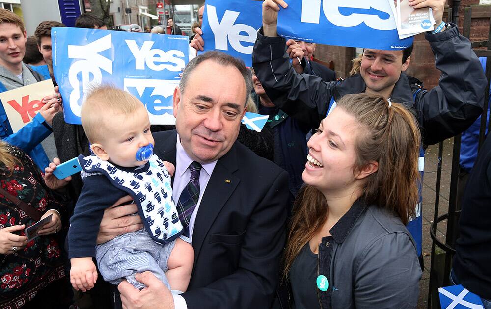 Scotland's First Minister Alex Salmond poses for photographs with Yes campaigners in Turriff, Scotland.